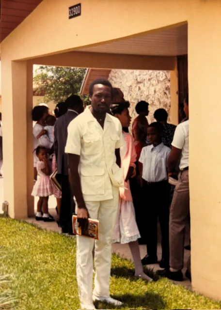 Abel standing outside a church in Miami in 1987