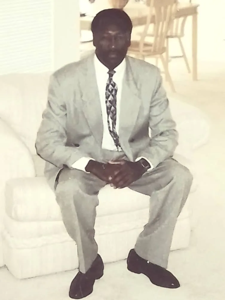 Young Abel seated in a light suit in an archival portrait