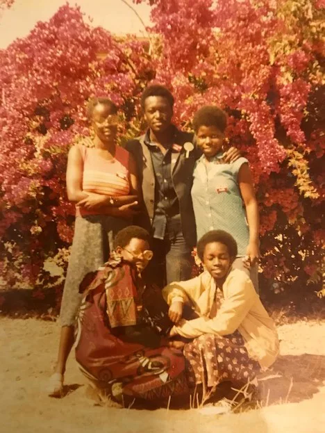 Abel sharing a moment with fellow participants in the 1980 census in Zambia