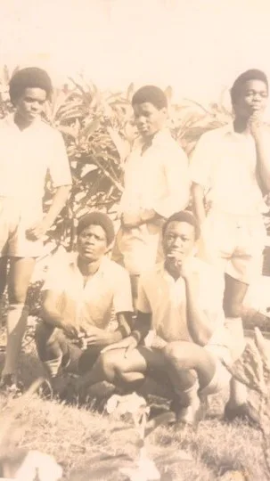 Abel sharing a moment with dorm-mates during his third year at Hillcrest Secondary School in Zambia